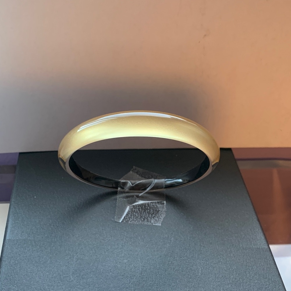 Alexis Bittar tapered bangle bracelet.